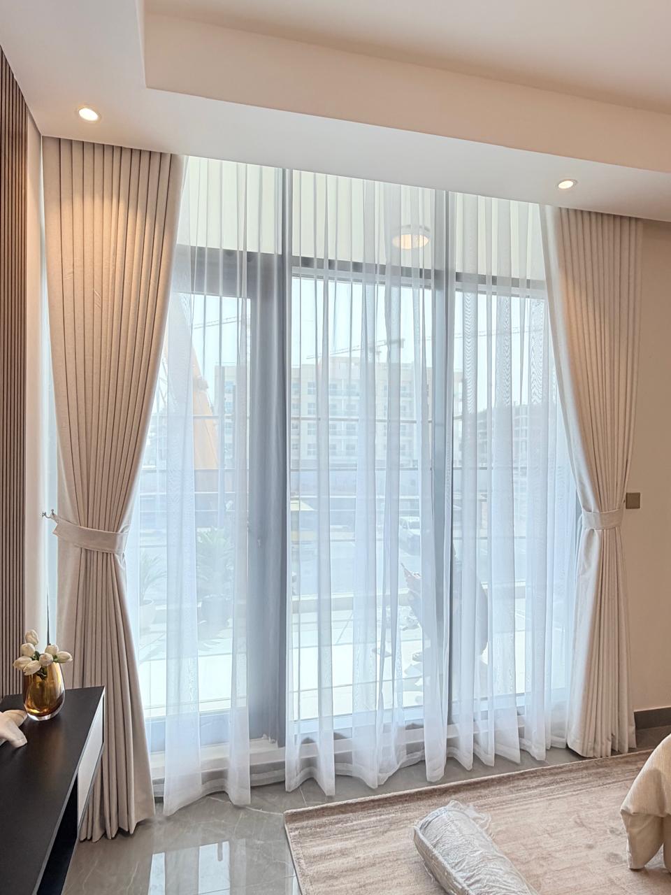 Curtains in a styled living room with a city view