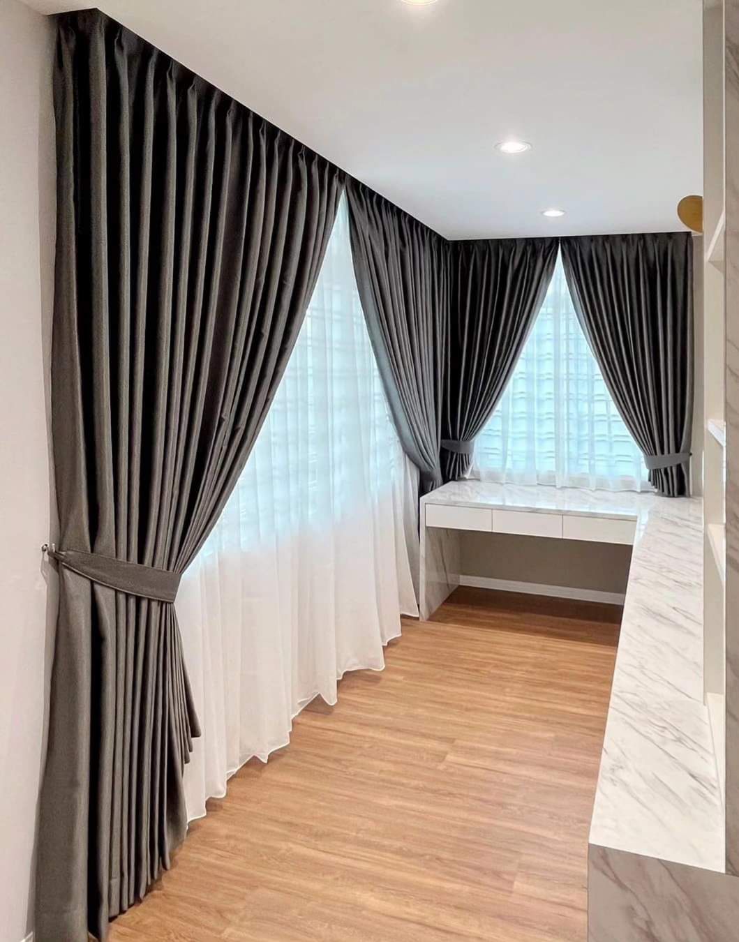 Dark taupe curtains and white sheer at a study window