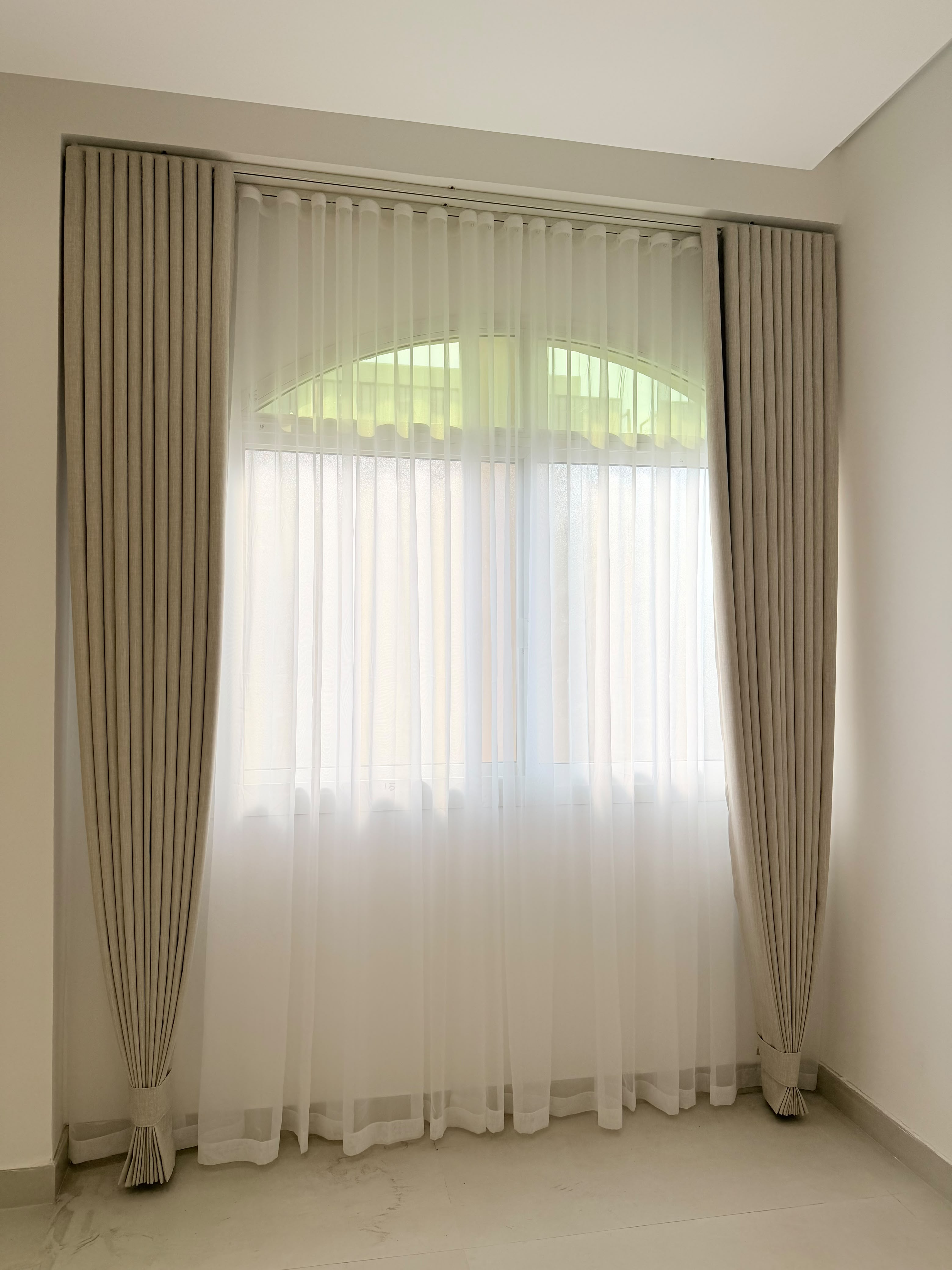 Sheer linen curtains with white voile in a Dubai home