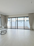 Tailored curtains framing floor-to-ceiling glass in a Dubai villa