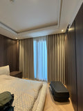 Bronze velvet curtains in a warm bedroom