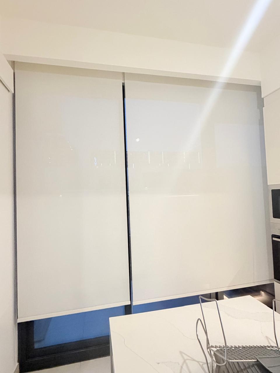 Roller blinds fitted in an office