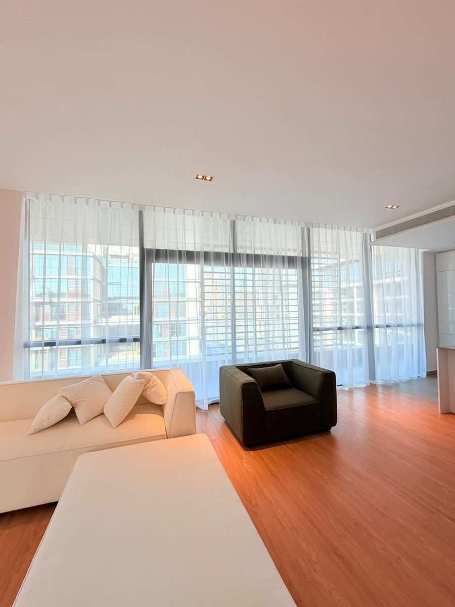 Floor-to-ceiling sheer curtains in a living room